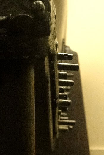 View along the string side of the neck, indicating the degree of difference in the lengths of the tuning pins.