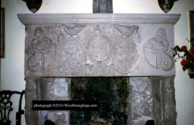 mantelpiece with mermaid carvings