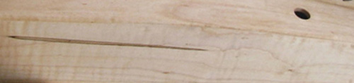 Photograph of a section of a harp made out of Hard Maple