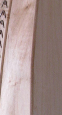Photograph of a section of a harp made out of of Soft Maple